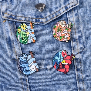 Creative sloth enamel pins set on denim jacket featuring nature and sunset scene patterns