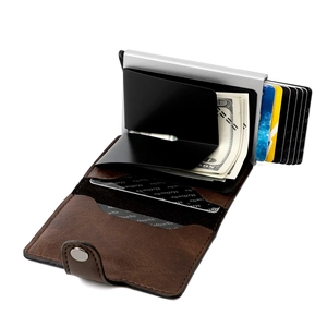 Detail of RFID blocking aluminum card holder with leather cover and metal money clip