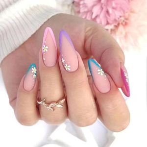 Detailed close-up of almond-shaped French nails with daisy patterns and colored edges
