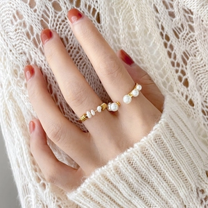 Elegant gold pearl rings set for women featuring delicate twist and minimalist open designs
