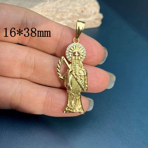 Close-up of gold grim reaper pendant 16x38mm with white zircons and red rhinestone eyes