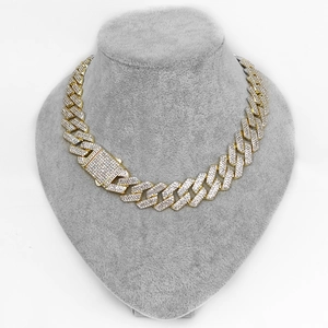 Close-up of 20mm hip-hop Cuban chain necklace with triple-row rhinestones on a bust