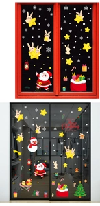 Detailed view of Christmas window decals featuring Santa, snowman, and tree on glass