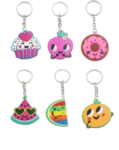 Macro view of six cartoon silicone keychains featuring fruit and dessert patterns