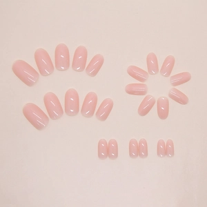 Short oval nude pink press-on nails with a glossy jelly finish and 24-piece layout