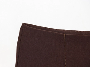 Detail of dark brown twill fabric showing professional stitching and textile texture