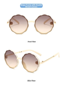 Detail of round flower-shaped children's sunglasses in beige with metal temples