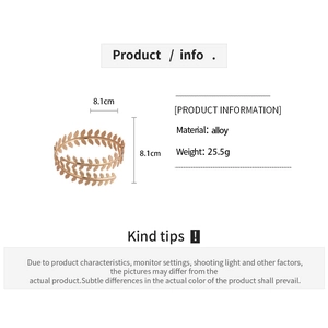 Detailed view of golden leaf arm cuff bracelet with alloy texture and size dimensions