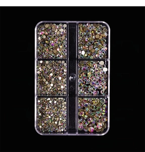 Detail view of 6-grid nail art AB rhinestones in various sizes for manicure decoration