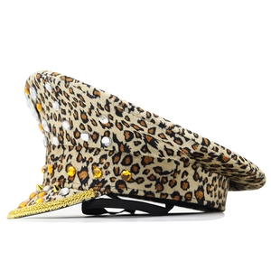 Side view of leopard print captain hat with sparkling gemstones and golden rope detail