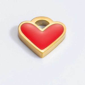 Close-up of heart-shaped red enamel pendant with 18k gold plated edge and top loop