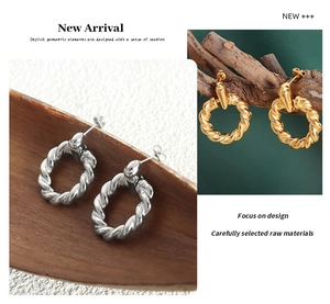 Detailed view of gold and silver twisted rope texture hoop earrings with metallic finish