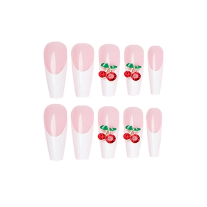 Long ballet press-on nails in nude pink with white french tips and red cherry rhinestones