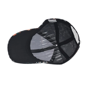 Detail view of the tie-dye baseball cap interior with breathable mesh and 100% polyester label