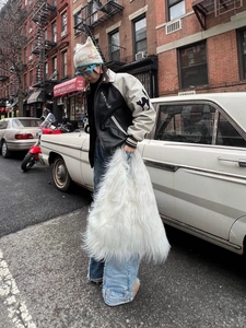 Y2K style fuzzy white plush tote bag paired with a cat-themed streetwear jacket