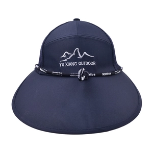 Detail of navy blue fishing hat with mountain embroidery and breathable mesh texture