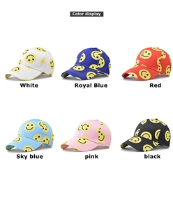 Detailed grid view showing baseball caps in white, blue, red, pink, and black with smiley prints