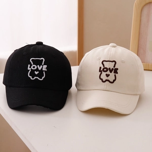 Detail of the high-quality bear embroidery and LOVE lettering on cotton baseball caps