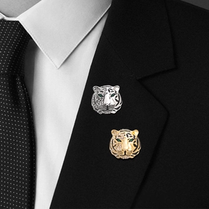 Luxe tiger head brooch with rhinestones and green eyes on a black suit lapel