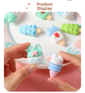 Close-up of bunny and ice cream shaped erasers in pastel macaron colors for school