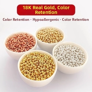 Detail of 18K gold plated beads for jewelry making in four metallic finishes