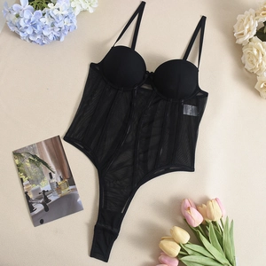 Macro detail of black mesh corset top with underwire support and sheer shaping panels