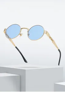 Macro view of blue steampunk round lenses and golden engraved metal frame detailing