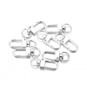 Close-up of polished silver alloy lobster clasps with swivel D-rings for DIY bags