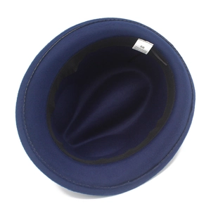 Detail view of navy wool felt hat interior showing size 58 label and polyester lining