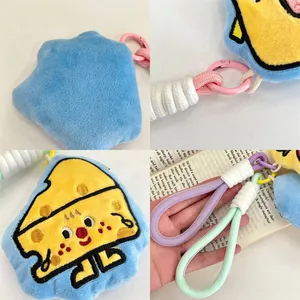 Detail of cartoon star plush keychain with embroidery, durable rope, and metal clasp
