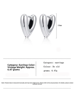 Macro view of V-shaped vintage silver heart hoop earrings with detailed sizing measurements