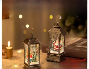 Detail of vintage bronze Christmas lanterns with Santa scenes and glitter snow effects