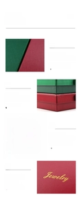 Detail of red and green jewelry boxes with dual ribbon bows and gold foil lettering