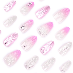 3D pink gradient press-on nails with pearl accents and 3D shell texture almond shape