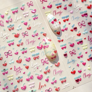 3D relief nail art stickers featuring red cherries with rhinestones and heart designs