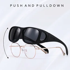 Polarized fit-over sunglasses designed to be worn over prescription eyewear for driving
