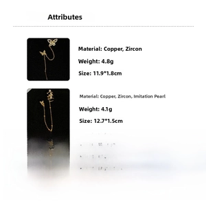 Detail view of long zircon butterfly earrings with pearl accents and dimensions