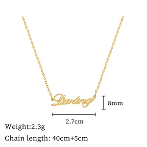 Flat lay of gold Darling necklace showing 2.7cm pendant size and 40cm chain length