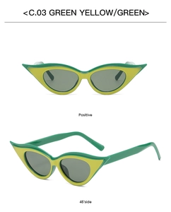 Detail view of bold cat-eye sunglasses in striking green and yellow contrast design