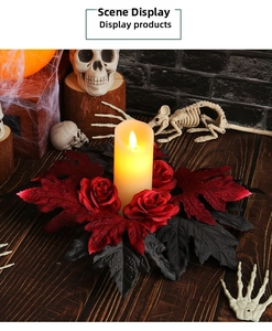 Gothic Halloween candle wreath with red roses, black maple leaves and warm LED candle light