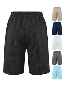Macro shot of texture of men waffle knit casual shorts with elastic drawstring waistband
