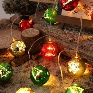 Festive LED Christmas ball string lights with red green and gold snowflake patterns