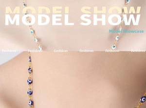 Detail showing two layered evil eye necklaces with colorful enamel drops on gold chains