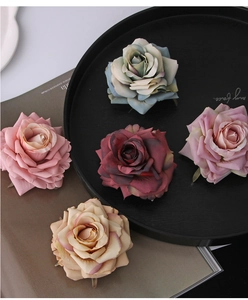 Detailed view of silk rose hair clips in vintage pink and morandi blue silk fabric