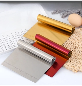 Three-piece stainless steel dough scrapers in silver, gold, and rose gold with scale marks