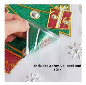 Detail of self-adhesive Christmas tree sticker with glitter finish and gold foil edges