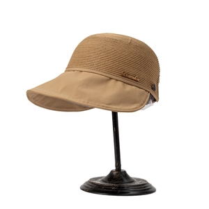 Women's khaki straw sun hat with wide brim and metal logo on a vintage stand