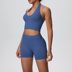 Detail of blue ribbed halter bra and high-waisted gym shorts set for workout