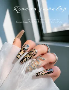 Detailed view of 3D snake nail art charms with rose gold finish and pavé zircon stones