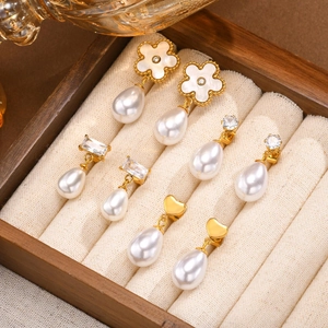 Set of four gold heart and flower earrings with drop pearls and sparkling cubic zirconia